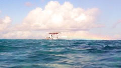 Rainbow over snorkel boat